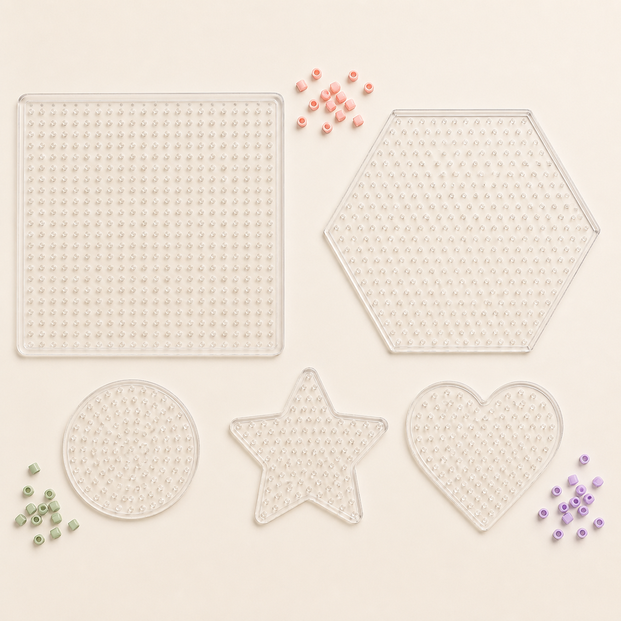 Five clear fuse bead pegboards in basic shapes