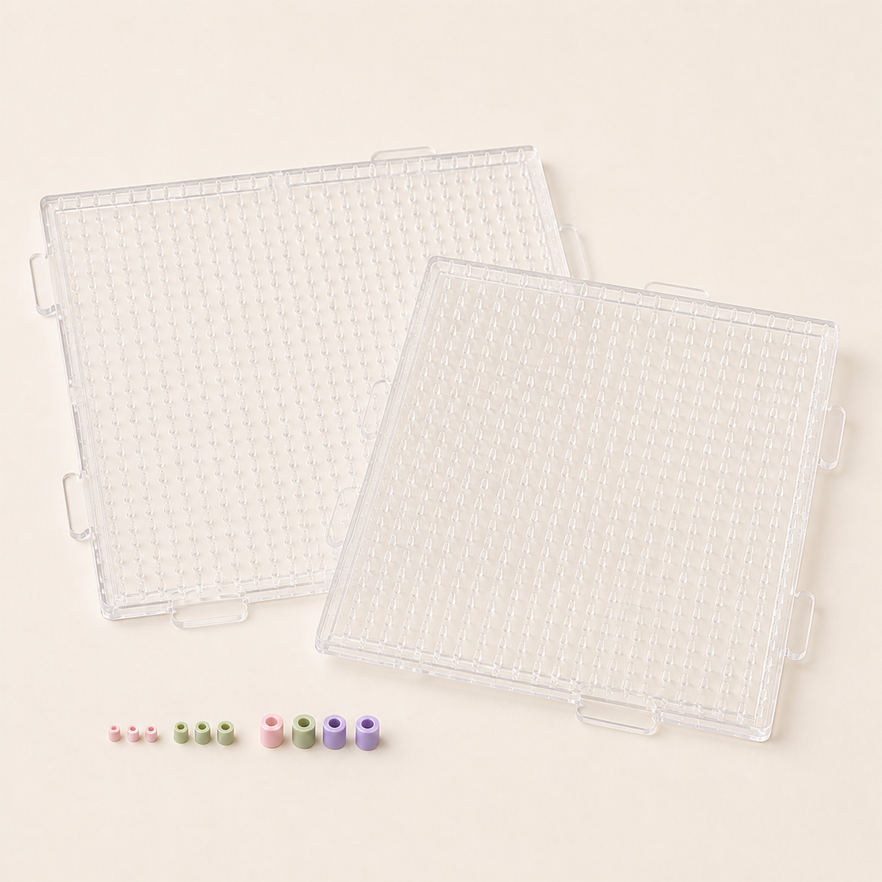 Two clear interlocking square fuse bead pegboards